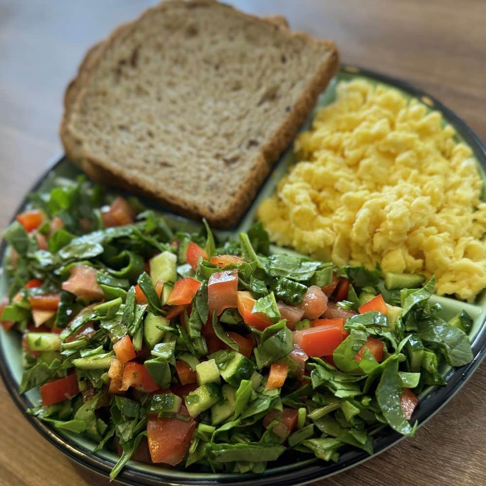 Scrambled eggs, fresh salad and wholegrain bread